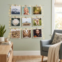Decorative grid wall display with square photos hung using small wooden pegs