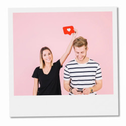 Classic retro instant style photo print of a couple on a pink background